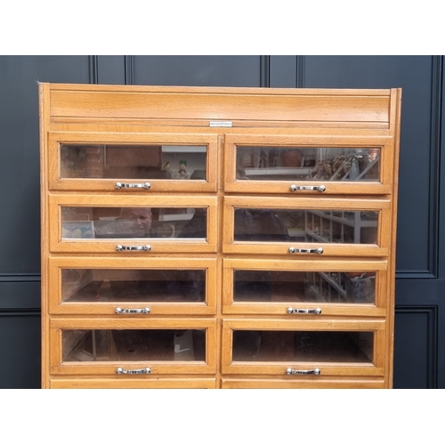 1020 - A mid-century oak multi-drawer haberdashery chest, labelled 'Modern Sales Equipment (Wales) Ltd', 18... 