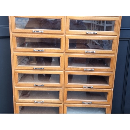 1020 - A mid-century oak multi-drawer haberdashery chest, labelled 'Modern Sales Equipment (Wales) Ltd', 18... 