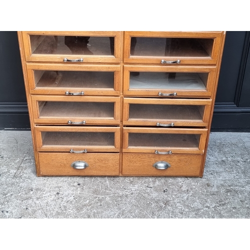 1020 - A mid-century oak multi-drawer haberdashery chest, labelled 'Modern Sales Equipment (Wales) Ltd', 18... 