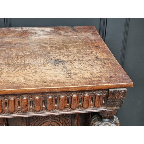 1023 - An antique oak and inlaid buffet, 108cm high x 125cm wide, (probable alterations).