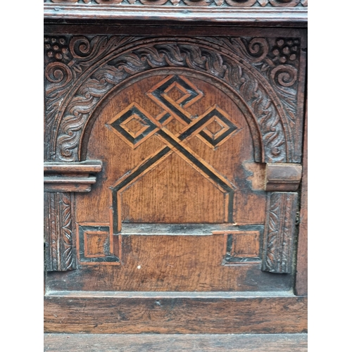 1023 - An antique oak and inlaid buffet, 108cm high x 125cm wide, (probable alterations).