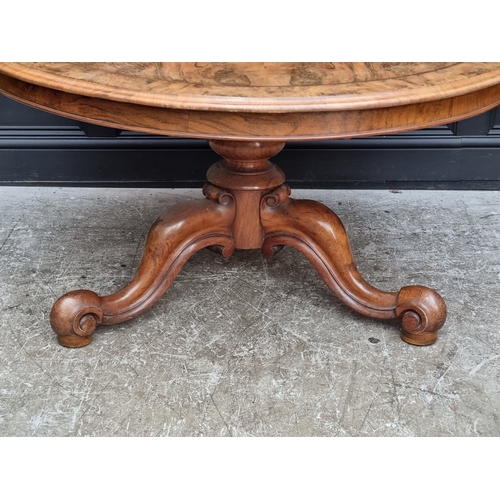 1031 - A good Victorian figured walnut circular tilt-top breakfast table, 129.5cm diameter.... 