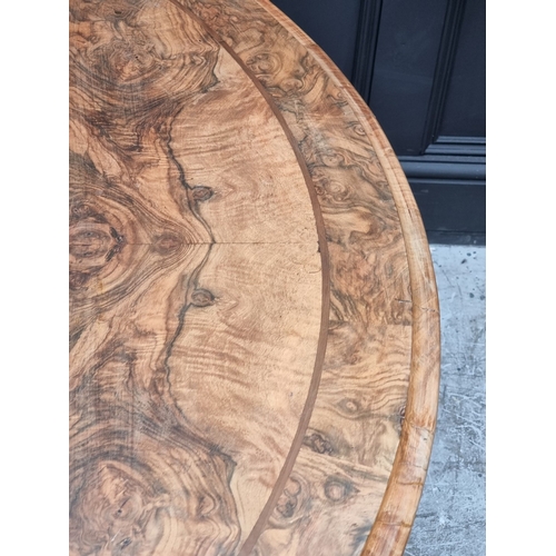 1031 - A good Victorian figured walnut circular tilt-top breakfast table, 129.5cm diameter.... 