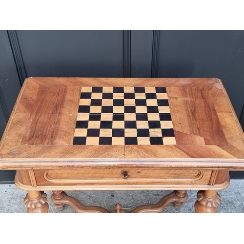 1046 - A late 19th century continental walnut and chequerboard inlaid fold-over card table, 79cm wide.... 