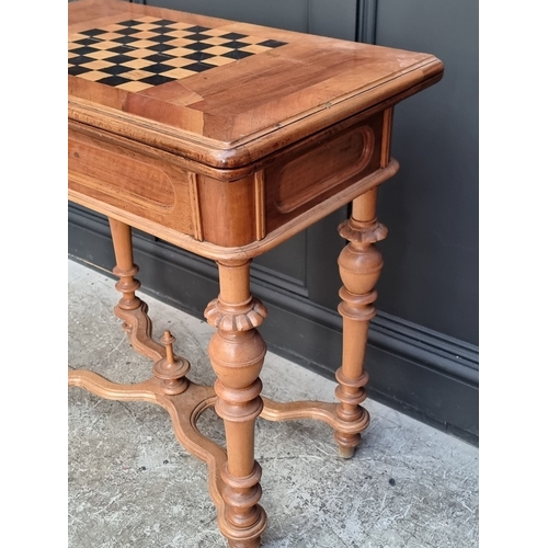 1046 - A late 19th century continental walnut and chequerboard inlaid fold-over card table, 79cm wide.... 