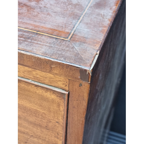 1061 - A George III mahogany and line inlaid chest of drawers, 91.5cm wide.