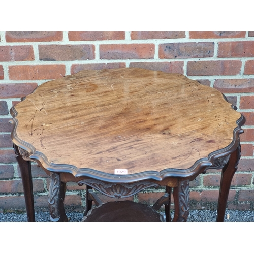 1029 - A circa 1900 mahogany centre table, of shaped outline, 73.5cm diameter.