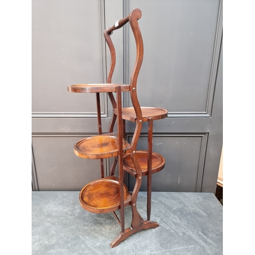 1063 - A 1920s mahogany folding five-tier cake stand.