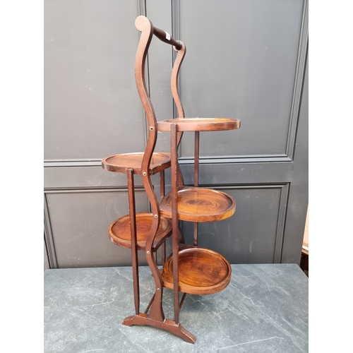 1063 - A 1920s mahogany folding five-tier cake stand.