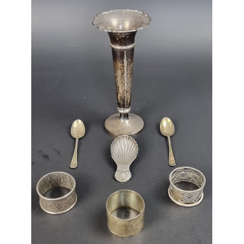 115 - Three silver napkin rings; together with two silver teaspoons; and a silver caddy spoon, 119g. (6)... 