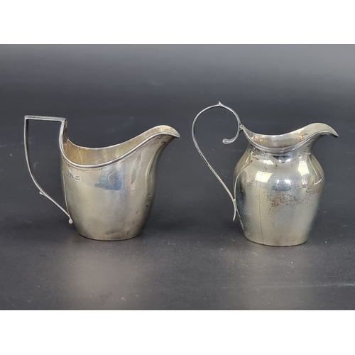 116 - Two silver milk jugs, Birmingham 1898 and 1915, largest 8.5cm high, 99g. (2)