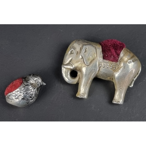 117 - A white metal novelty chick pin cushion, 29mm long; together with an elephant example, by Barrowclif... 