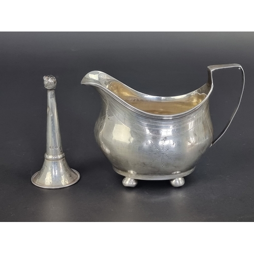 121 - A Georgian silver cream jug, marks rubbed, height to handle 9.5cm; together with a silver trumpet va... 