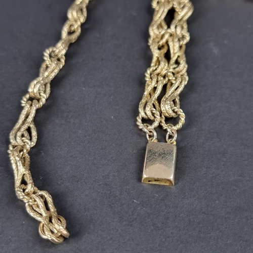 159 - A yellow metal textured crossover link necklace, the clasp stamped '375', 39cm; together with a matc... 