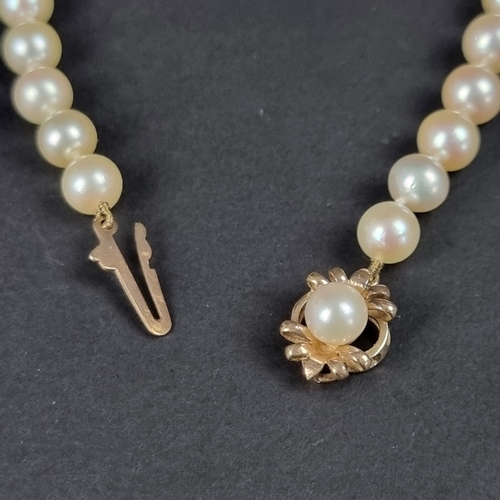 160 - A cultured pearl necklace, with 9ct gold clasp set pearl, 46.5cm; together with a similar pair of 9c... 