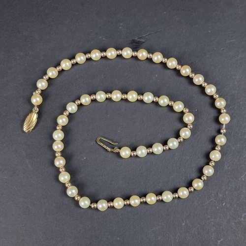 161 - A cultured pearl and gold bead necklace, with 9ct gold clasp, 42cm long.