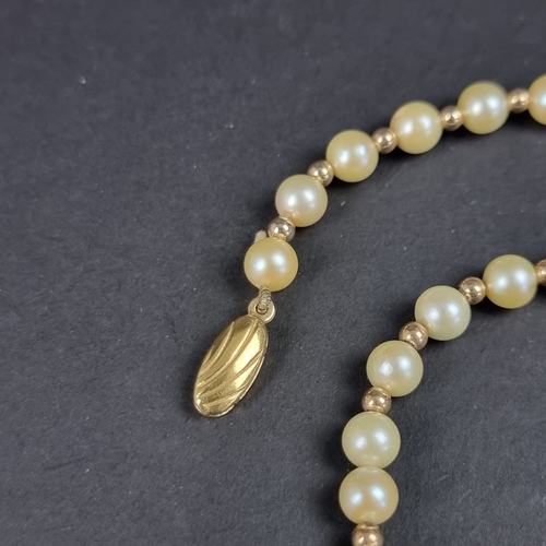 161 - A cultured pearl and gold bead necklace, with 9ct gold clasp, 42cm long.