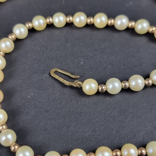 161 - A cultured pearl and gold bead necklace, with 9ct gold clasp, 42cm long.