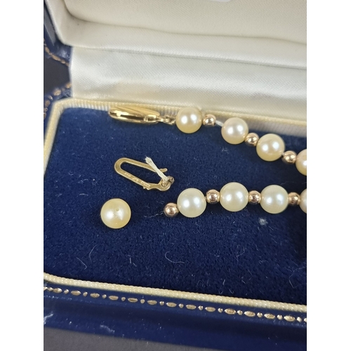 161 - A cultured pearl and gold bead necklace, with 9ct gold clasp, 42cm long.