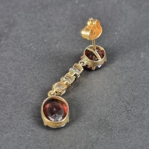 166 - A pair of yellow metal garnet and white gemstone set pendant earrings, 29mm long, in Trevor Towner b... 