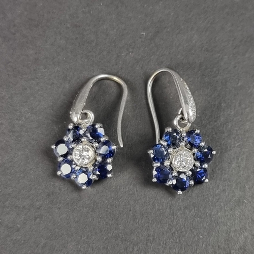 168 - A pair of sapphire and diamond cluster earrings, 12mm diameter.