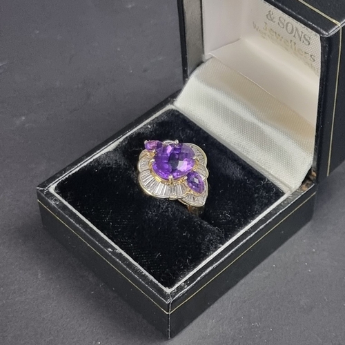 172 - An 18ct gold amethyst and baguette diamond cluster ring, size L 1/2, gross weight 7g.... 