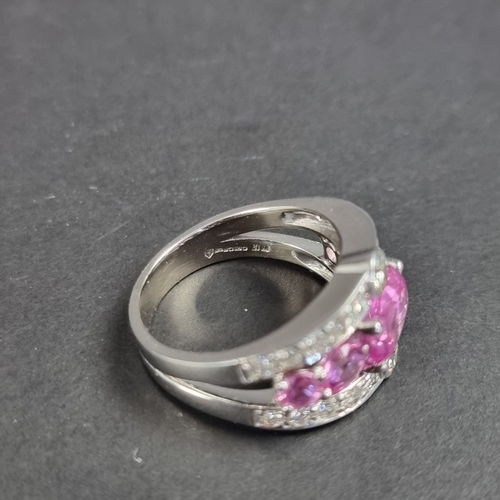 173 - A 18ct white gold pink sapphire and diamond encrusted ring, by Timothy Roe, London 2012, size Q 1/2,... 