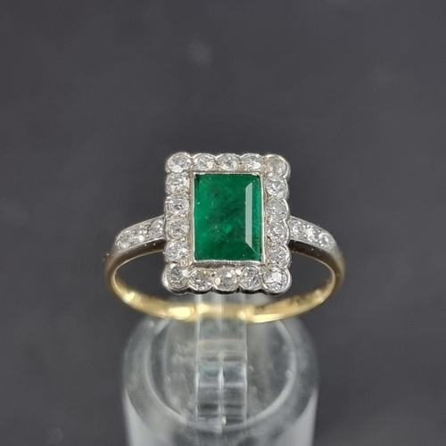 174 - An Art Deco style yellow metal emerald and diamond cluster ring, size V.