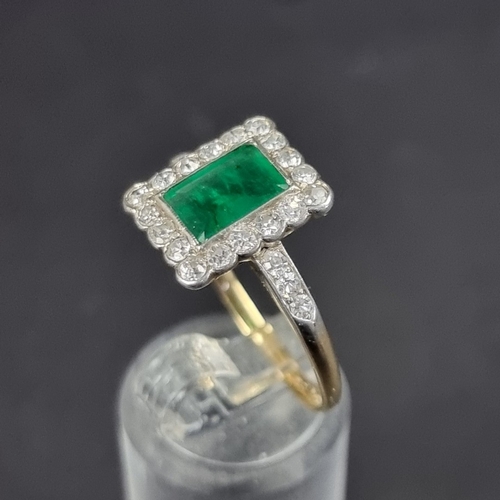 174 - An Art Deco style yellow metal emerald and diamond cluster ring, size V.