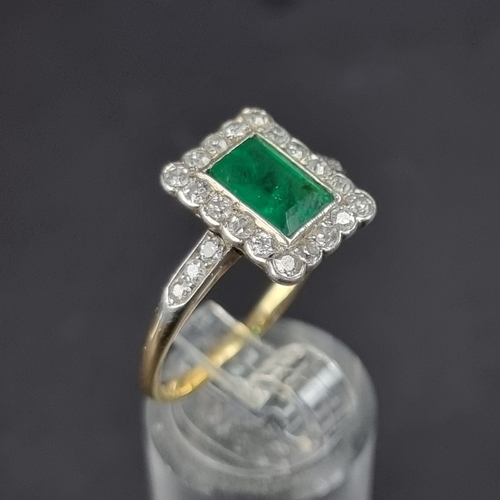 174 - An Art Deco style yellow metal emerald and diamond cluster ring, size V.