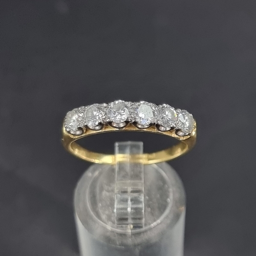 177 - An 18ct gold diamond six stone half eternity ring, estimated at 1.2ct in total, size R 1/2, gross we... 