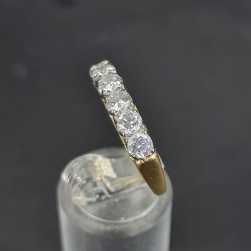 177 - An 18ct gold diamond six stone half eternity ring, estimated at 1.2ct in total, size R 1/2, gross we... 