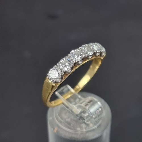 177 - An 18ct gold diamond six stone half eternity ring, estimated at 1.2ct in total, size R 1/2, gross we... 