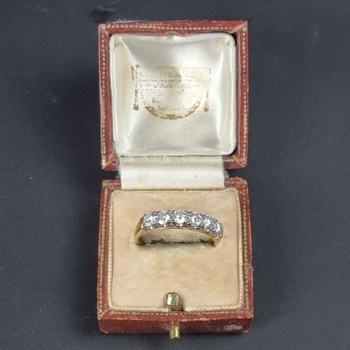 177 - An 18ct gold diamond six stone half eternity ring, estimated at 1.2ct in total, size R 1/2, gross we... 