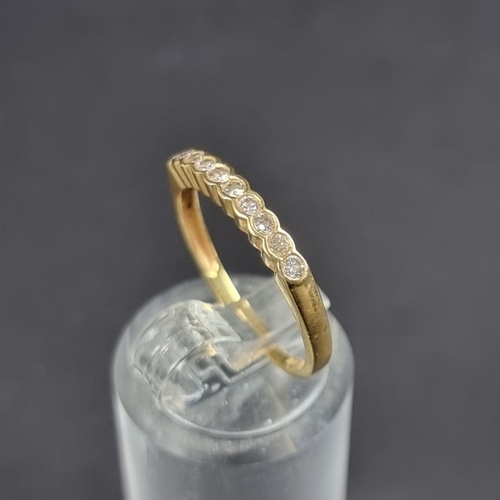 181 - A yellow metal diamond half eternity ring, set with ten diamonds, totalling approximately 0.33ct, si... 