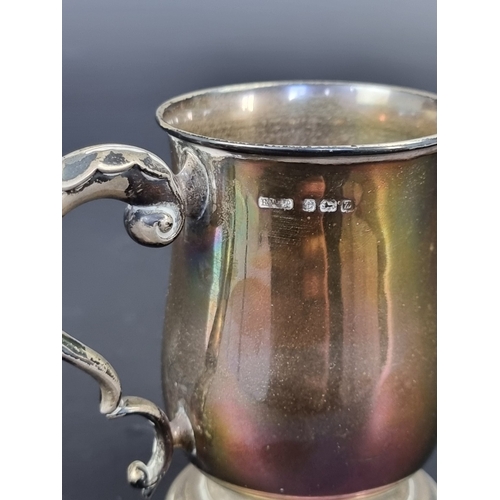 23 - A silver mug, by Henry Williamson Ltd, Birmingham 1924, 9.5cm high, 123g.