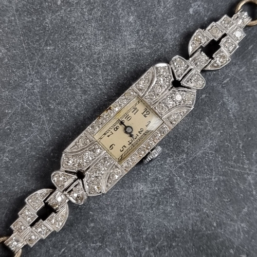 379 - An Art Deco platinum and diamond set manual wind ladies cocktail wristwatch, 11mm x 24mm, on origina... 