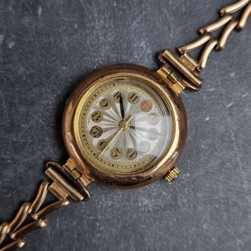 381 - A 1920s 9ct gold quartz ladies wristwatch, 25mm, having replacement quartz movement, on integrated 9... 