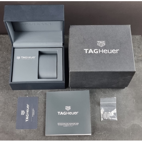 389 - A circa 2018 Tag Heuer wristwatch box; to include two spare links measuring 18.5mm wide; warran... 