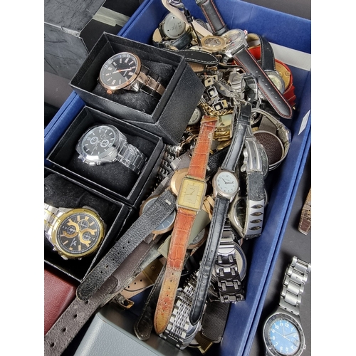 391 - A large group of wristwatches; to include examples by Certina, Seiko, Swatch and Navigator.... 