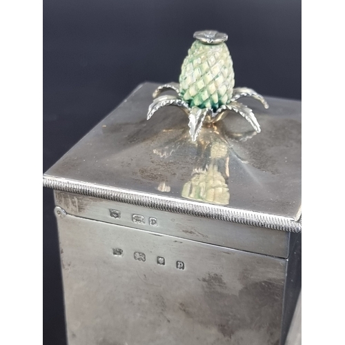 40 - A silver tea caddy, having ivory thistle finial by D & J Wellby Ltd, London 1939, 12cm high; tog... 