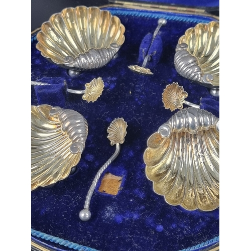 63 - A cased set of four Victorian silver salts and spoons, by Mitchell Bosley & Co, Birmingham 1898,... 