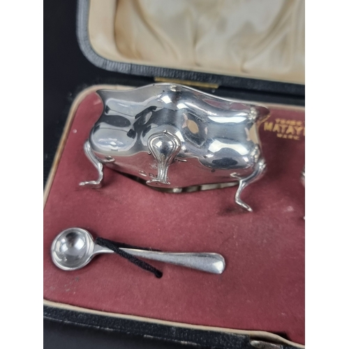 69 - A cased pair of silver salts, by Levesley Brothers, Sheffield 1911, one spoon by different maker; to... 