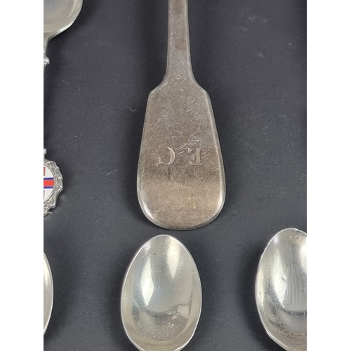 78 - Nine silver spoons; together with a pair of silver sugar tongs, 264g. (10)