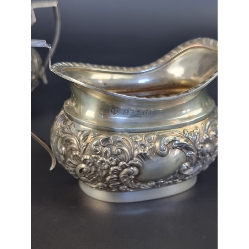 8 - An Edwardian silver sugar bowl and matching milk jug, by Williams Ltd, Birmingham 1903/5, height to ... 