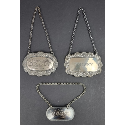 86 - A silver decanter label, by A Marston & Co, Birmingham 1965; together with two other silver... 