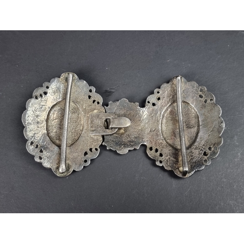 94 - A 19th century Indian Lucknow white metal and enamel belt buckle, 15cm wide.