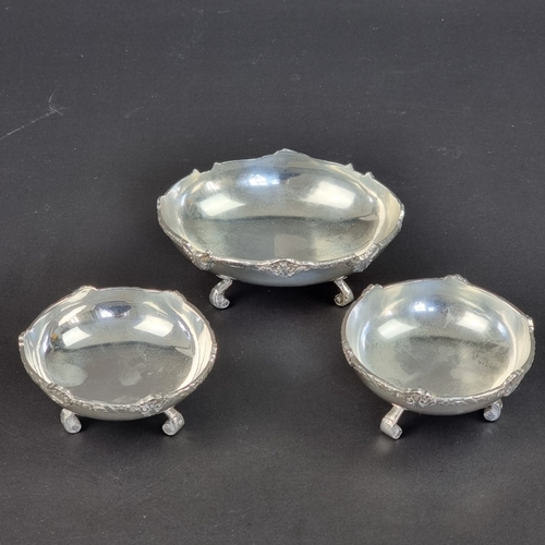 96A - A set of three Egyptian white metal bowls, largest 12cm wide.