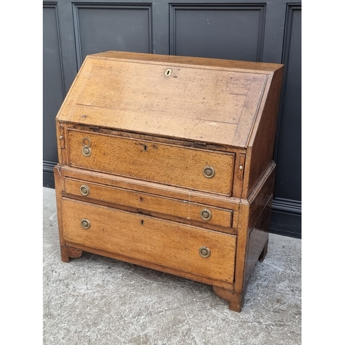 1003 - An 18th century oak bureau, in two parts, 91cm wide, (alterations).
