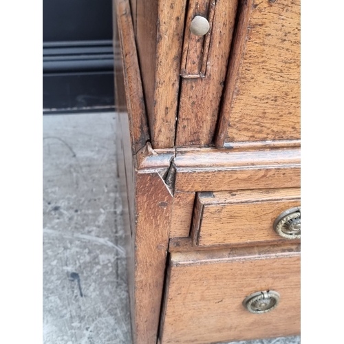 1003 - An 18th century oak bureau, in two parts, 91cm wide, (alterations).